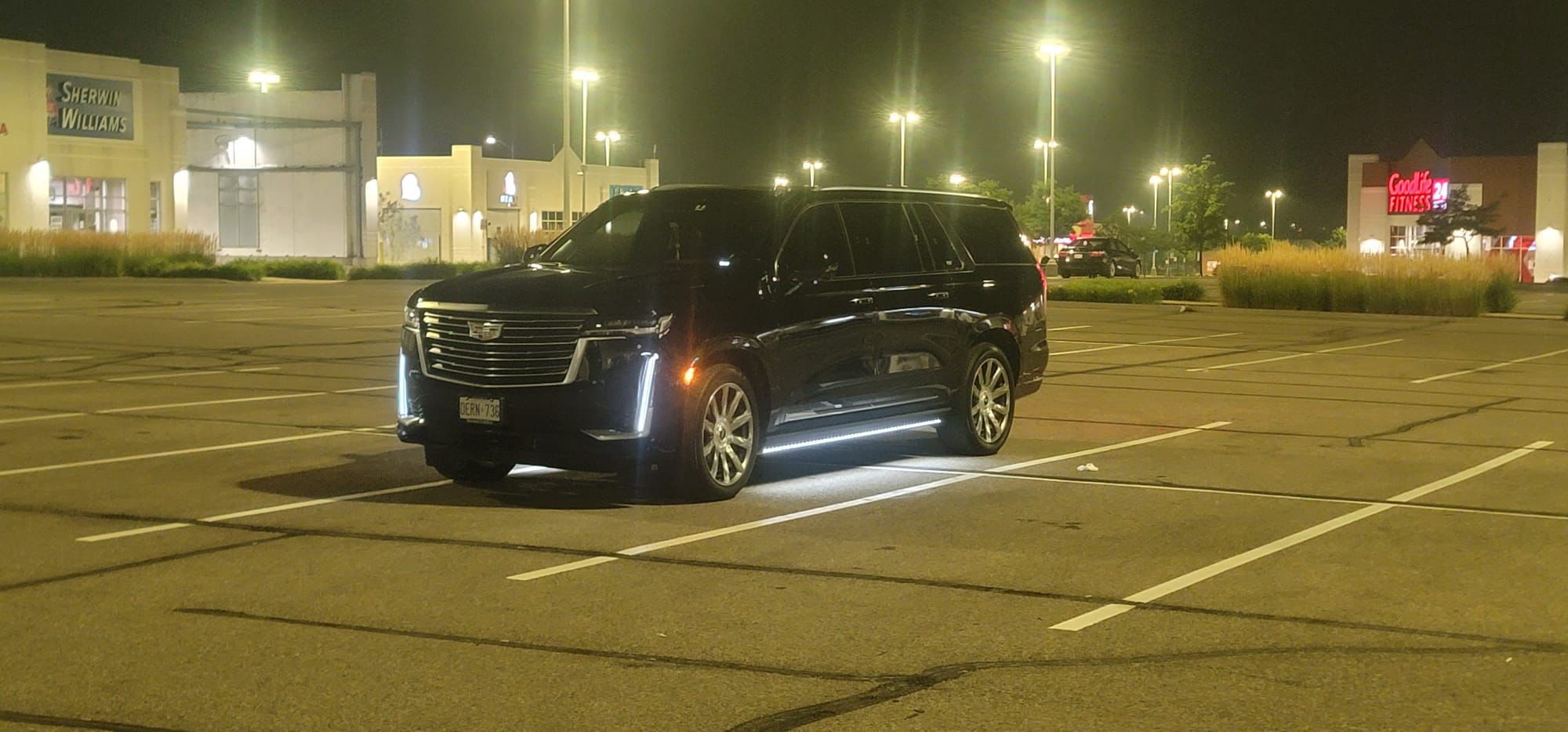 Black Cadillac Escalade from the LUXPRO fleet at night