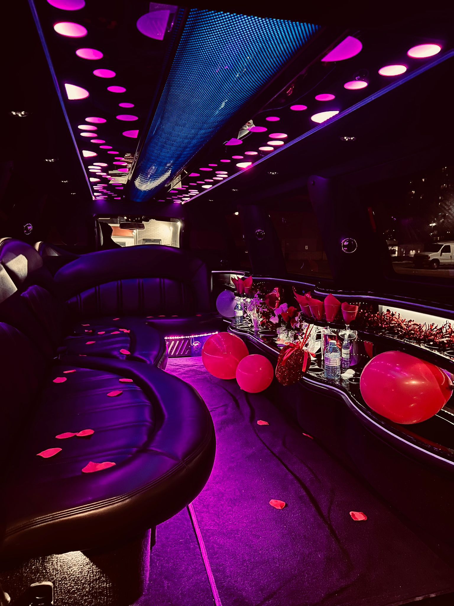 Pink illuminated party limousine interior